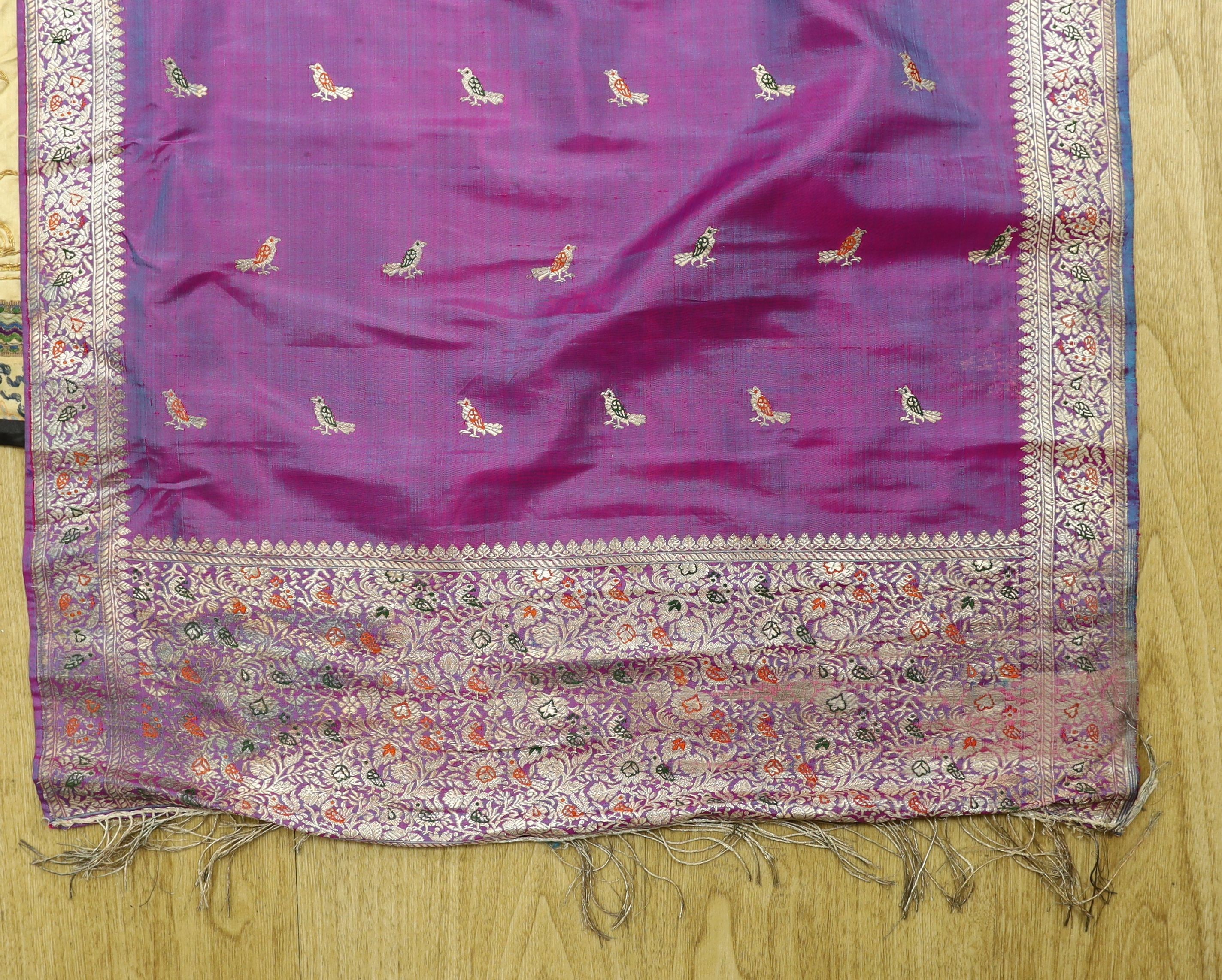A Chinese embroidered silk panel of a phoenix, 84.5 x 54 cm, an Indian silk panel and a metal beadwork purse